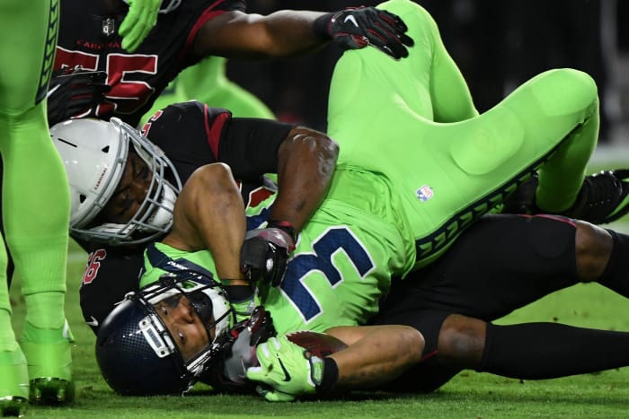 Cardinals linebacker Karlos Dansby (56) tackles Seahawks running back Thomas Rawls (34) during the first half at University of Phoenix Stadium, Nov. 9, 2017.